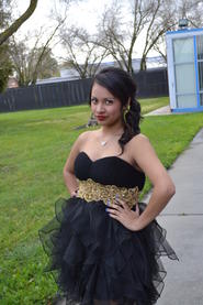 female student posing wearing a dress